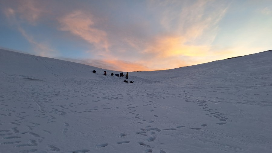 People digging snow holes in the Cairngorms